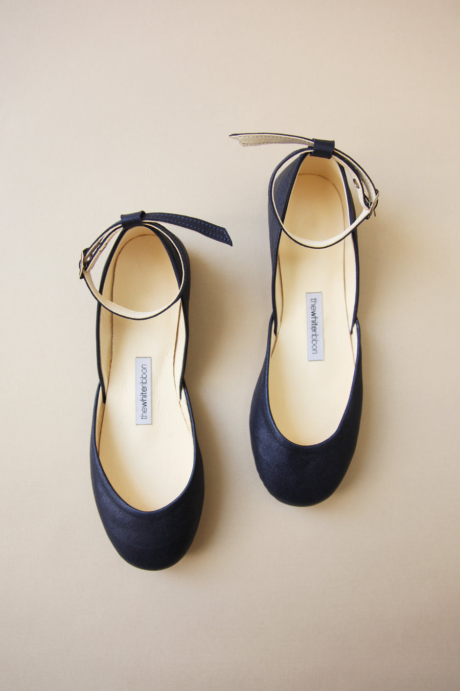 Shiny dark blue ballet flats with buckles