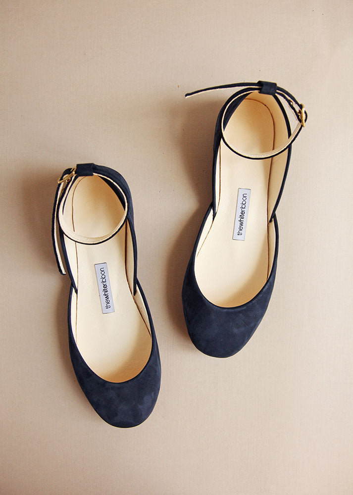 top shot of dark blue nubuck leather ballerinas with ankle straps 