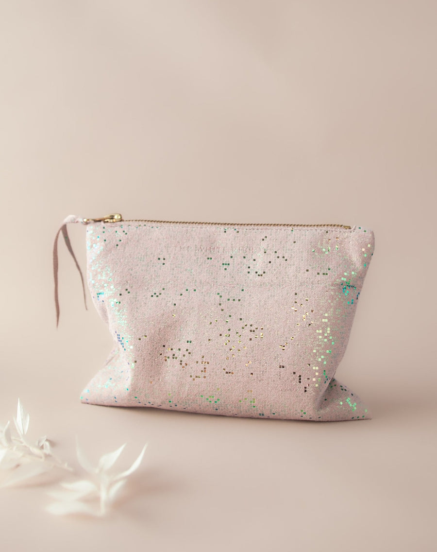 Mosaic patterned leather purse on neutral background