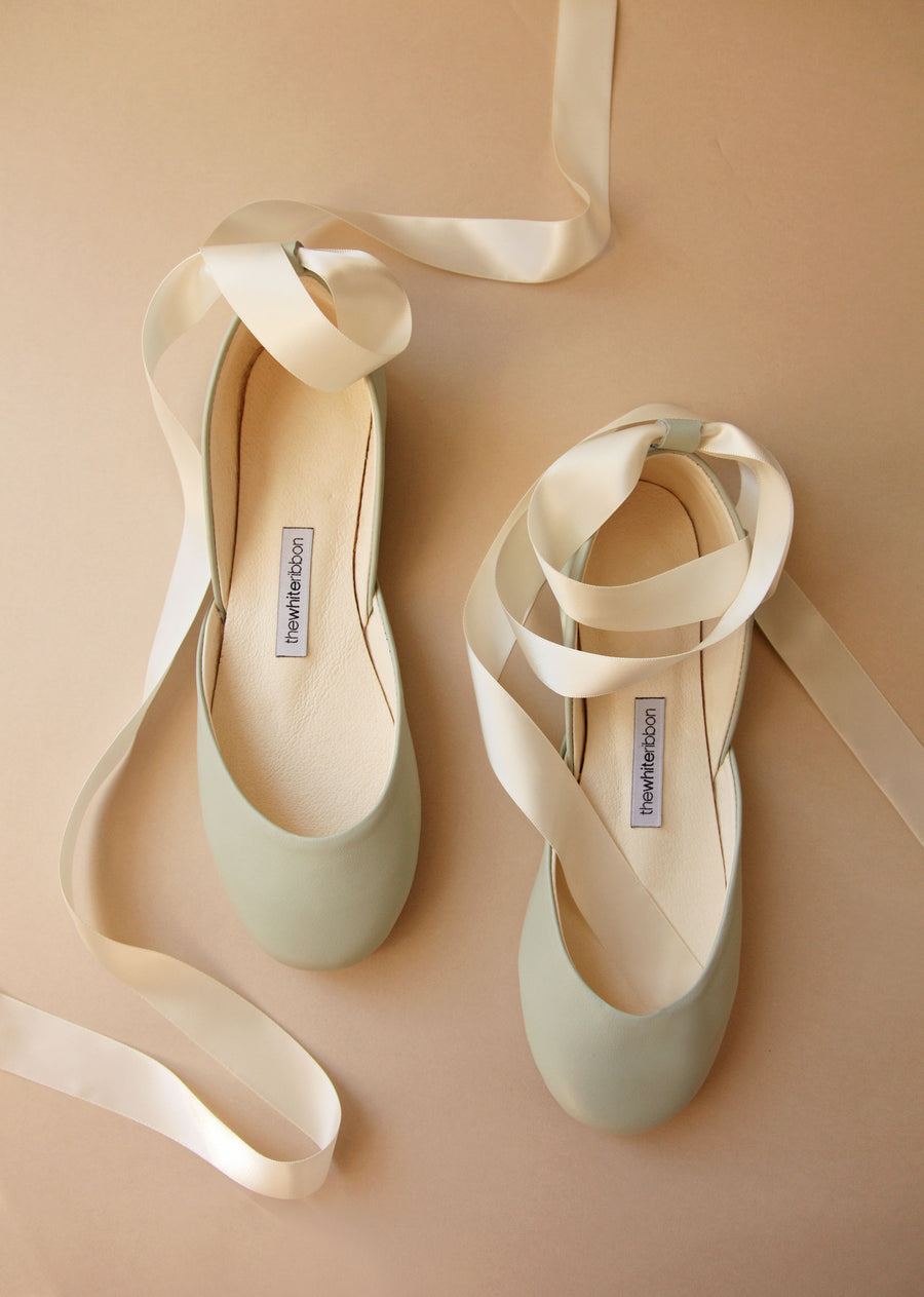 light pastel mint shade smoothe leather ballet flats with cream satin ribbons in top view