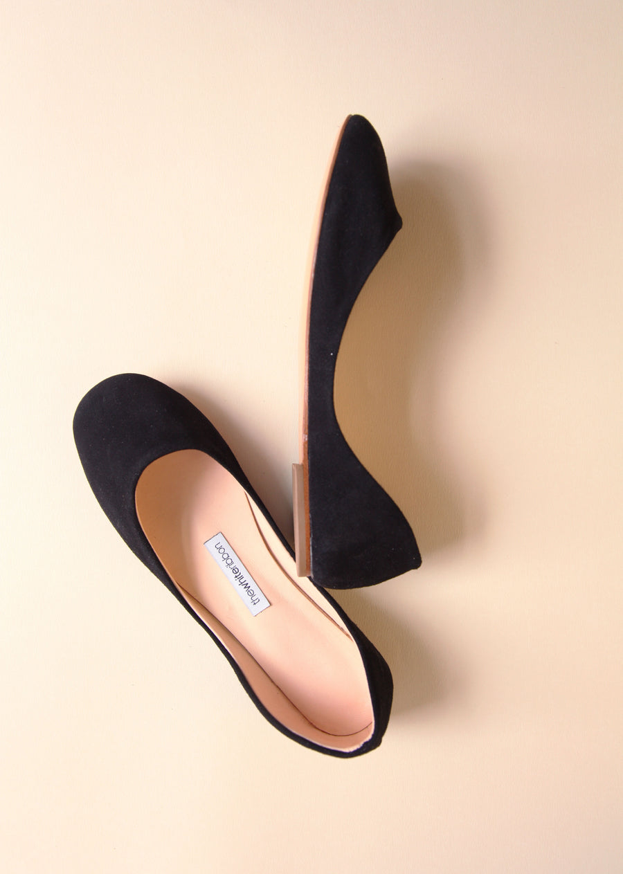 one piece black soft leather ballet flats in top and side view