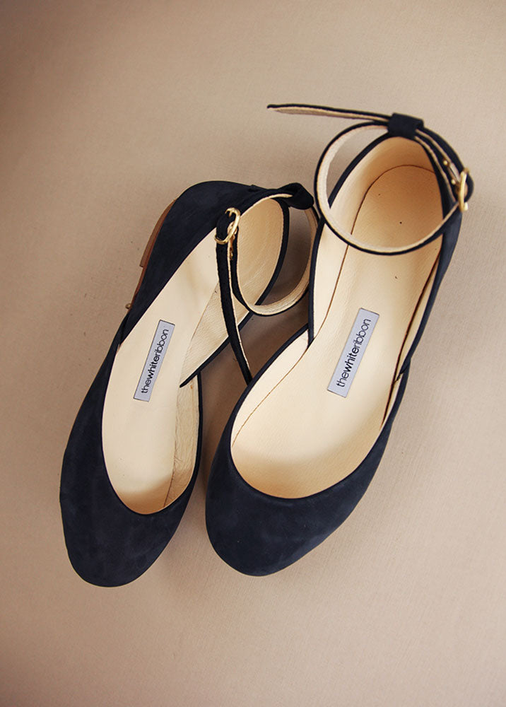 side and top view of ballerinas of soft leather in dark blue shade